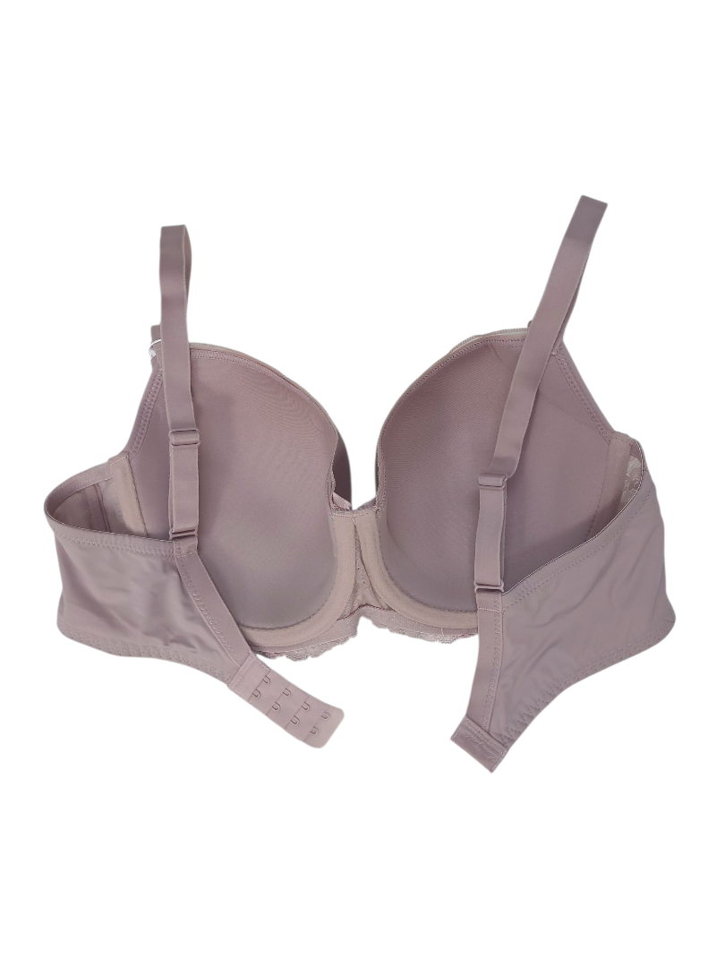 Kobiecy stanik w odcieniu pudrowego różu z fiszbinami.